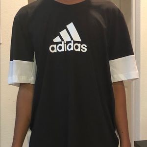 Adidas black and white two fabric Tee.